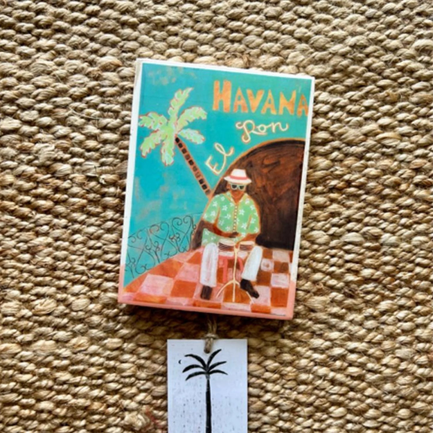 Decorative tile with a Cuban theme on a textured surface