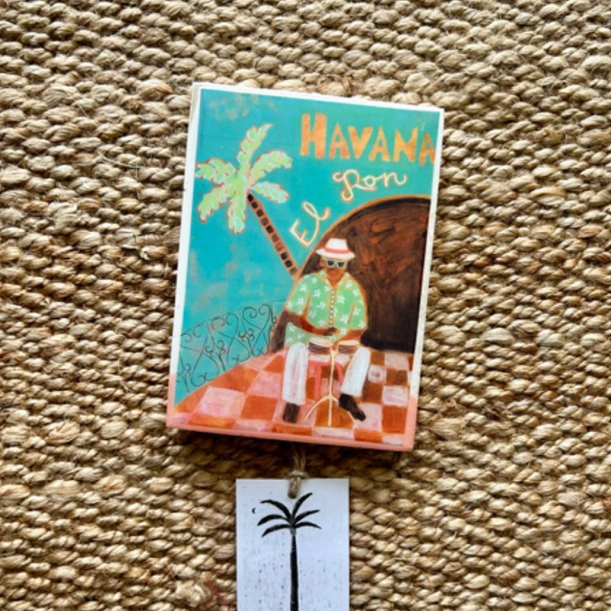 Decorative tile with a Cuban theme on a textured surface