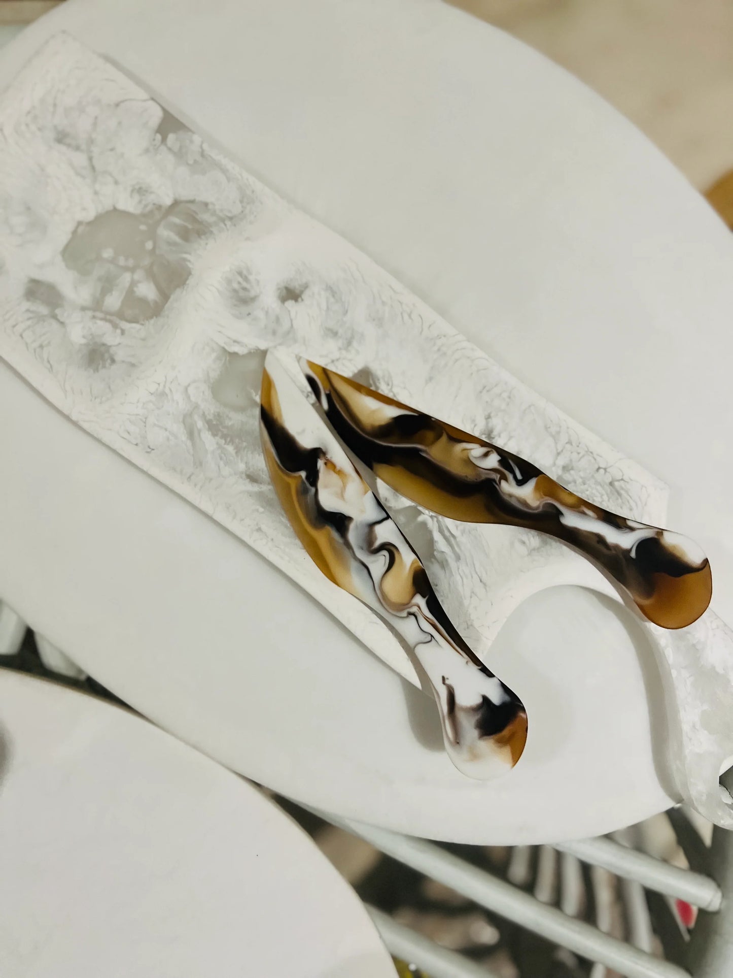 Resin cheese knife on table